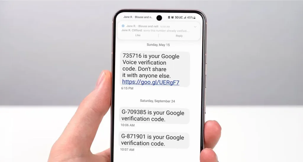 A smartphone displaying SMS text messages with Google verification codes.